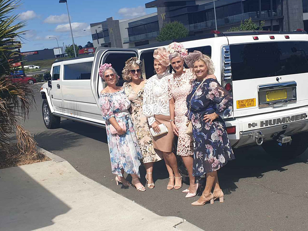 wedding party with stretch hummer limo